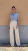 Flavia Amato indossa Pantalone palazzo gessato lyocell seacell abbigliamento sartoriale brand malia lab tessuti naturali pantalone sartoriale su misura