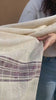 Flavia Amato indossa Scialle CORA cotone lavorazione a fascia colorata ampio atelier moda sostenibile abbigliamento artigianale etico a fascia singola