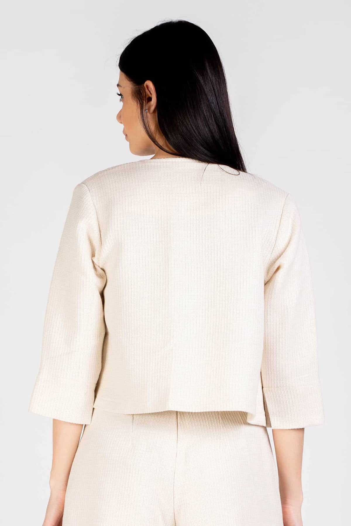 Bolero Doris lana biologica cotone biologico brand malia lab moda sostenibile abbigliamento sostenibile artigianale 4 stagioni giacca sartoriale dettaglio posteriore